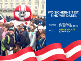 HELMI in einer Menge von Kindern auf dem Heldenplatz in Wien. Der Bildtext: Wo Sicherheit ist, sind wir dabei. Wann? 26.10.2025, 09:00-17:00 Uhr, Wo? Heldenplatz, 1010 Wien